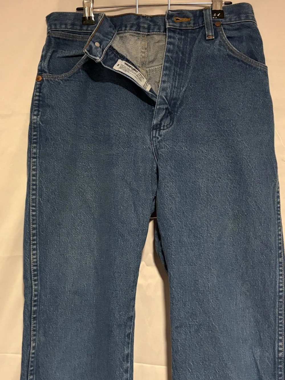 Wrangler Relaxed Fit Denim Jeans in Medium Blue with Orange Stitching